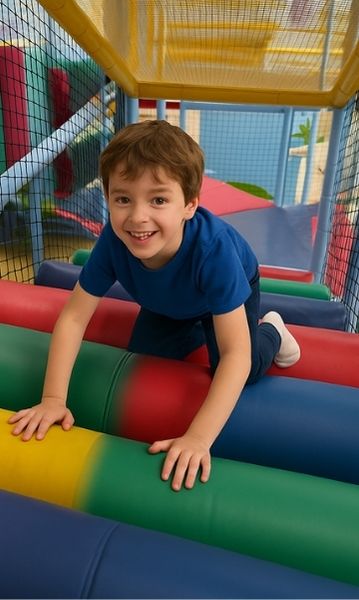 child climbing multi-level indoor playground built by Northwest Play.